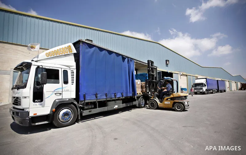 Palestinian Ministry of Health during moving convoy of twenty trucks carrying medicine to Gaza Strip from the west bank city of Nablus on June 18, 2011. Photo by Wagdi Eshtayah . ..