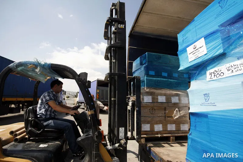 Palestinian Ministry of Health during moving convoy of twenty trucks carrying medicine to Gaza Strip from the west bank city of Nablus on June 18, 2011. Photo by Wagdi Eshtayah . ..