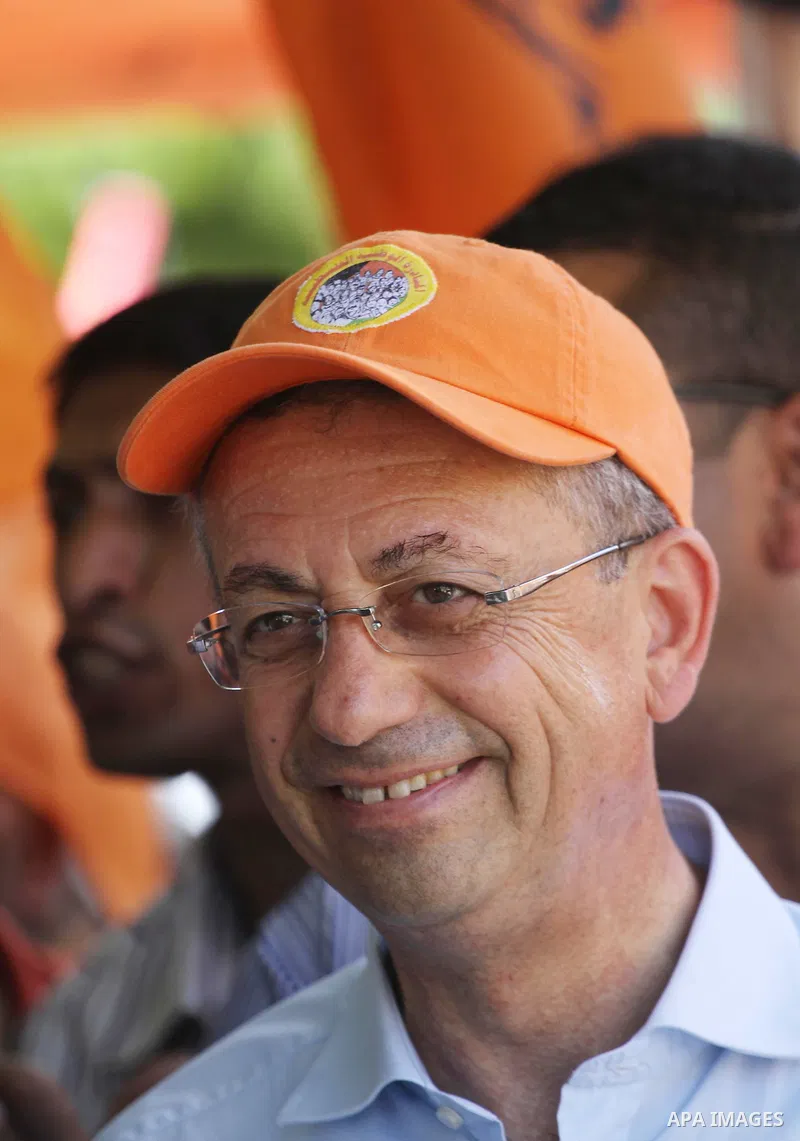 The head of Palestinian National Initiative movement, Mustafa al-Barghuti participates in a rally to mark the ninth anniversary of the movement foundation in Gaza city on Jun 18,2011. Photo by Mohammed Asad