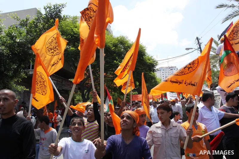 Members of Palestinian National Initiative movement participate in a rally to mark the ninth anniversary of the movement foundation in Gaza city on Jun 18,2011. Photo by Mohammed Asad