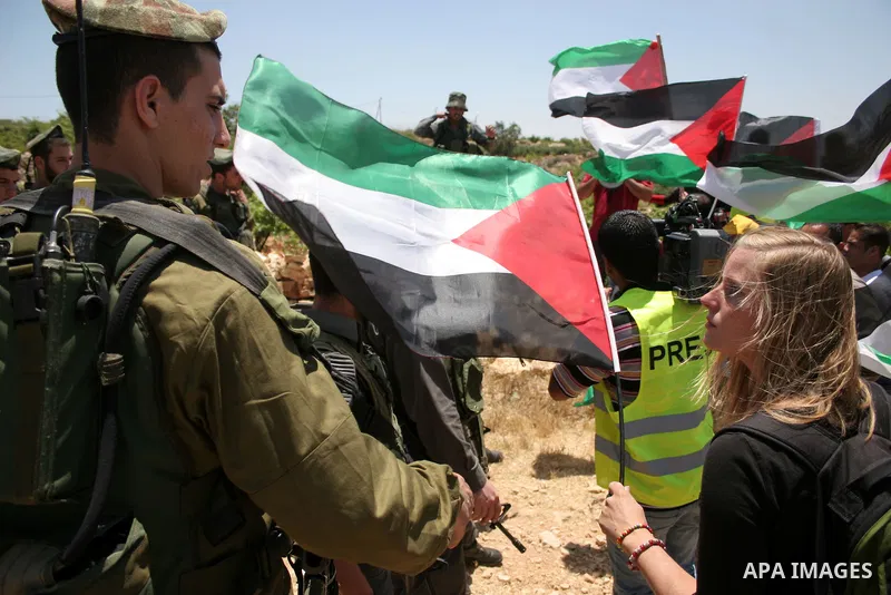 Israeli soldiers scuffle with protesters on Jun 18, 2011 during a demonstration by foreign, Israeli and Palestinian activists against the Jewish settlement of Karmei Tzur near the Palestinian village of Beit Omar, just n...