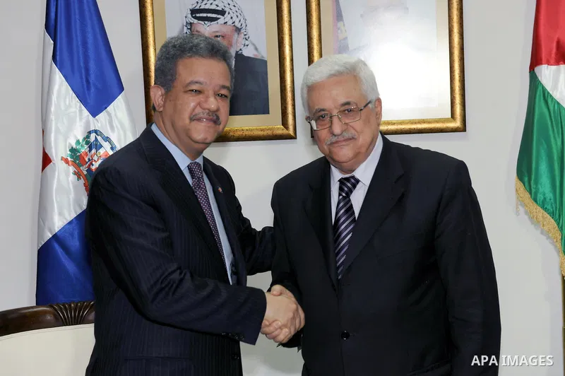 Palestinian President Mahmoud Abbas (Abu Mazen) shakes hands with his Dominican counterpart Leonel Fernandez during a meeting in the West Bank city of Ramallah on June 19, 2011. Photo by Thaer Ganaim