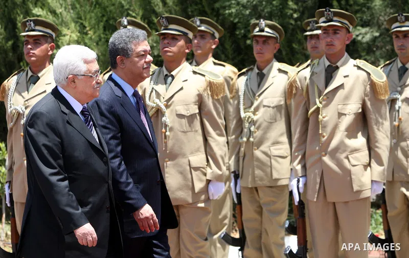 Palestinian President Mahmoud Abbas (Abu Mazen) eviews an honour guard with his Dominican counterpart Leonel Fernandez upon the latter's arrival for a meeting in the West Bank city of Ramallah on June 19, 2011. Photo by...