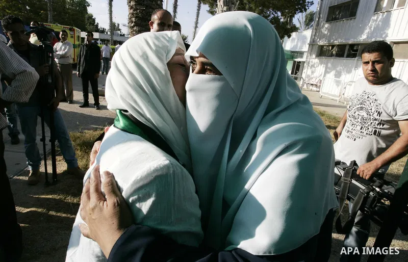Activists from the "Miles of Smiles 3" charity are welcomed by locals after crossing with medical aid into Gaza through the Rafah crossing Egypt on June 19, 2011. The convoy, carrying medical aid for the impoverished Pal...