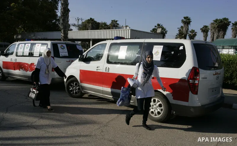 A convoy of "Miles of Smiles 3" carrying medical aid to Gaza crosses the Rafah crossing into the southern Gaza Strip from Egypt on June 19, 2011. The convoy, carrying medical aid for the impoverished Palestinian territor...