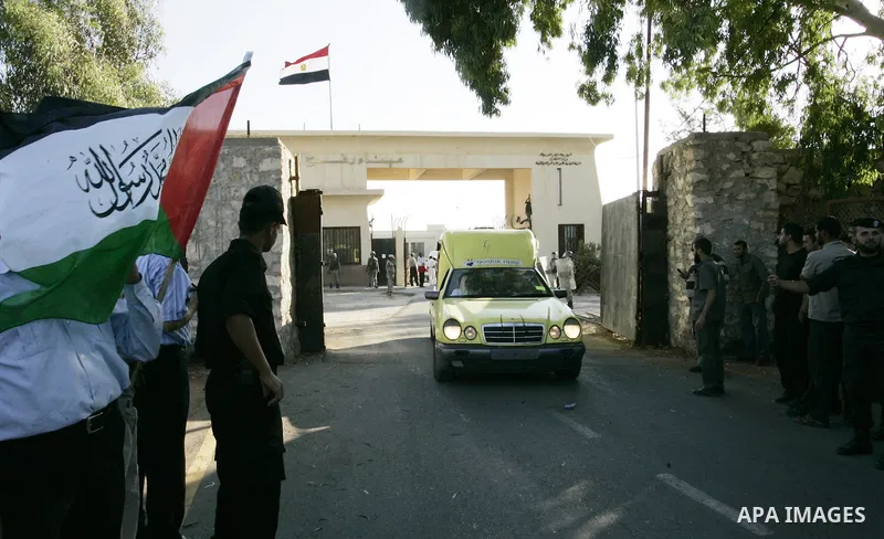 A convoy of "Miles of Smiles 3" carrying medical aid to Gaza crosses the Rafah crossing into the southern Gaza Strip from Egypt on June 19, 2011. The convoy, carrying medical aid for the impoverished Palestinian territor...