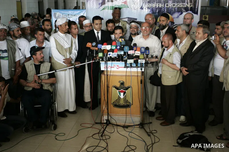 A convoy of "Miles of Smiles 3" carrying medical aid to Gaza crosses the Rafah crossing into the southern Gaza Strip from Egypt on June 19, 2011. The convoy, carrying medical aid for the impoverished Palestinian territor...