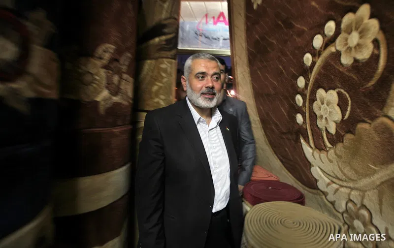 Palestinian Prime Minister in Gaza, Ismail Haniya inspect clothing stores during the opening ceremony of Al-Shuhada Street in Gaza City on June 19, 2011. Photo by Ali Jadallah