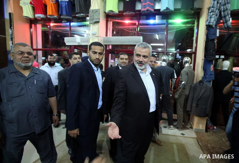 Palestinian Prime Minister in Gaza, Ismail Haniya inspect clothing stores during the opening ceremony of Al-Shuhada Street in Gaza City on June 19, 2011. Photo by Ali Jadallah