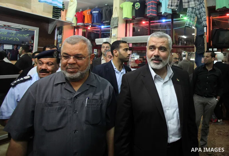 Palestinian Prime Minister in Gaza, Ismail Haniya inspect clothing stores during the opening ceremony of Al-Shuhada Street in Gaza City on June 19, 2011. Photo by Ali Jadallah