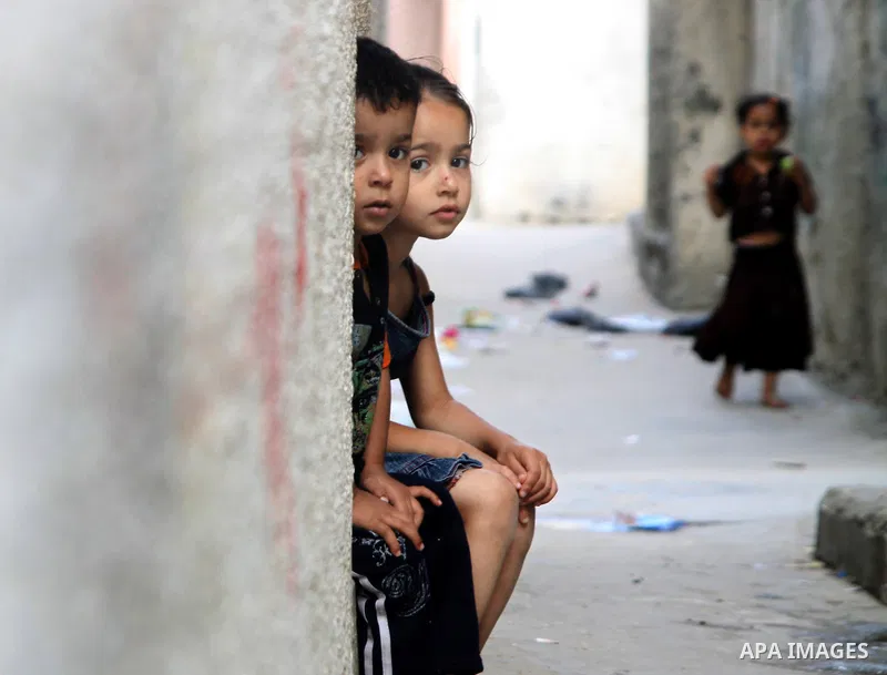 Palestinian children play in front of their house in the Jabaliya refugee camp in the northern area of the Gaza Strip on June 20, 2011. Reports state that the Islamic militant group Hamas is weighing a new strategy of no...