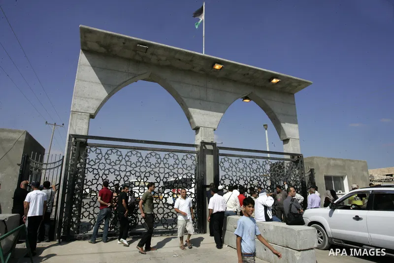 Palestinians wait to cross into Egypt through the Rafah border crossing in the southern Gaza Strip on June 20, 2011. Photo by Abed Rahim Khatib
