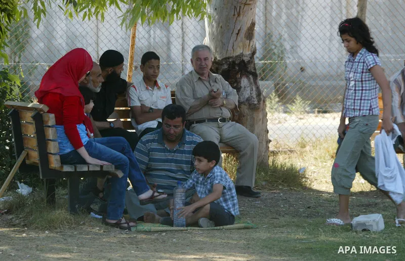 Palestinians wait to cross into Egypt through the Rafah border crossing in the southern Gaza Strip on June 20, 2011. Photo by Abed Rahim Khatib