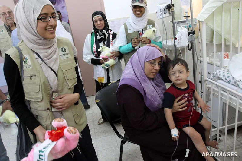 A convoy of "Miles of Smiles 3" distribute about 15 small vehicles and other health-care supplies for the impoverished Palestinian territory on June 20, 2011. coming yesterday from Egypt to Gaza strip according to a Hama...