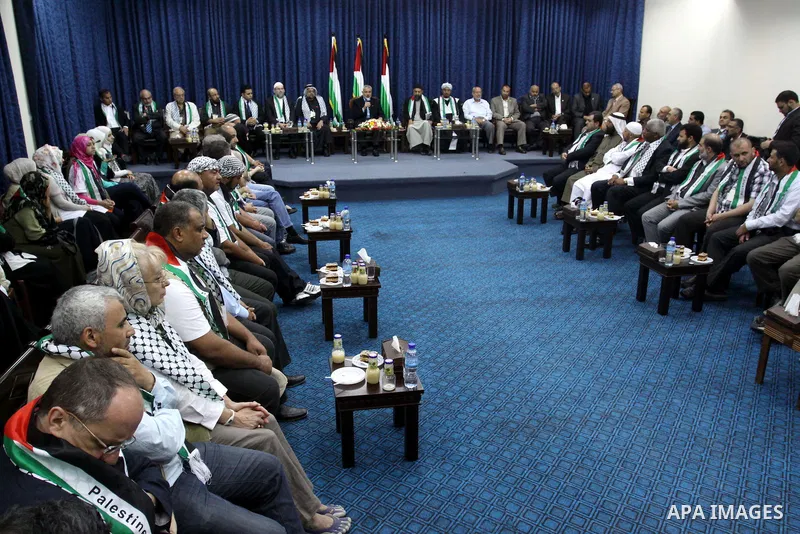 Palestinian Prime Minister in Gaza Strip, Ismail Haniya meets with members of the "Miles of Smiles 3" aid convoy in his office in Gaza city on Jun 20,2011. The convoy, carrying medical aid for the impoverished Palestinia...