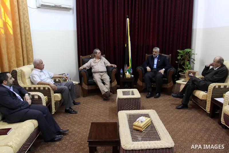 Palestinian Prime Minister in Gaza, Ismail Haniya meets the member of the Political Bureau of the Popular Front, Rabah Muhanna in his office in Gaza city on june 22, 2011. Photo by Mohammed Asad