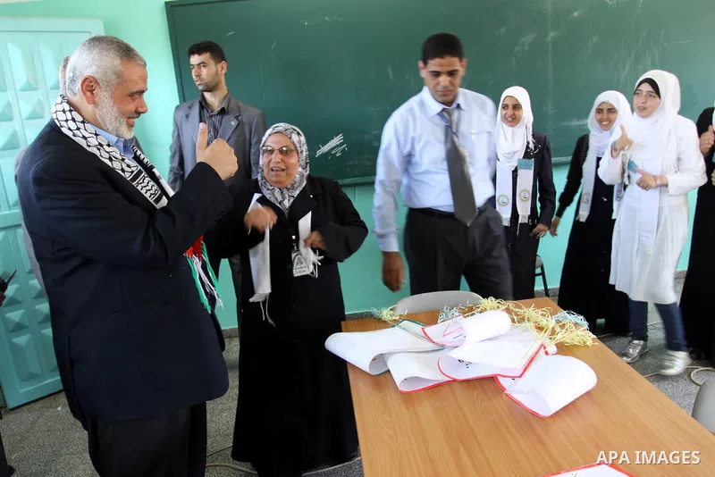Palestinian prime minister in Gaza Strip, Ismail Haniya attends the opening of the first school in Palestine for deaf students, in Gaza city on Jun 22,2011. Photo by Mohammed Asad