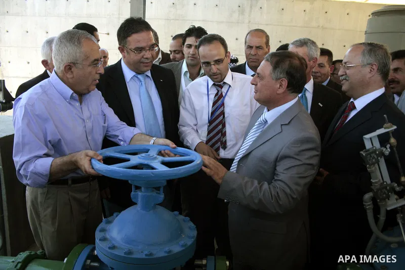 Palestinian prime minister Salam Fayyad attends the inauguration ceremony for well stations rehabilitation project in the southern West Bank village of Tuqu'a, which was financed by the US Agency for international Develo...