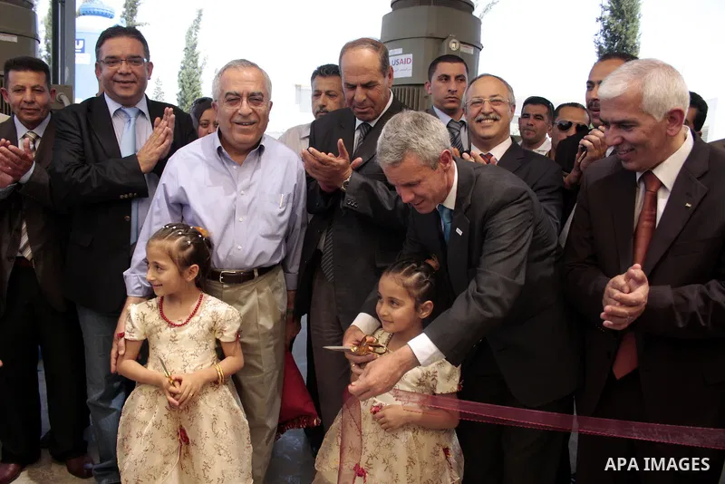 Palestinian prime minister Salam Fayyad attends the inauguration ceremony for well stations rehabilitation project in the southern West Bank village of Tuqu'a, which was financed by the US Agency for international Develo...