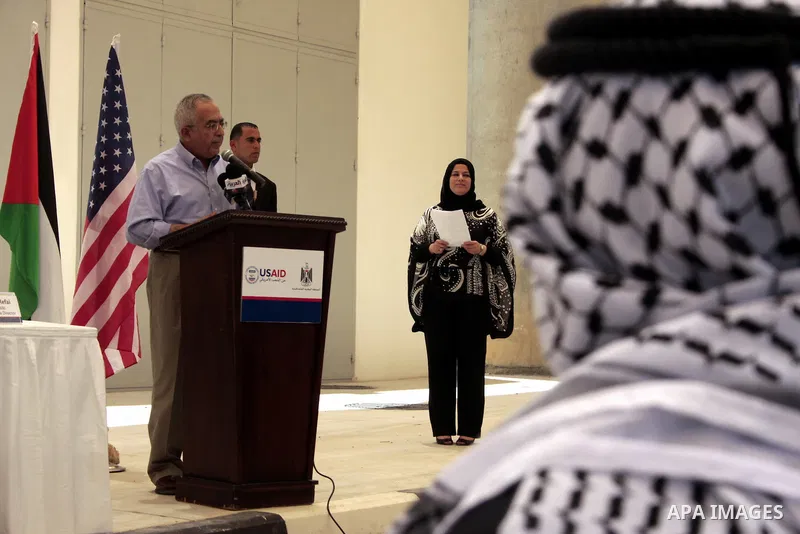 Palestinian prime minister Salam Fayyad delivers a speech during the inauguration ceremony for well stations rehabilitation project in the southern West Bank village of Tuqu'a, which was financed by the US Agency for int...