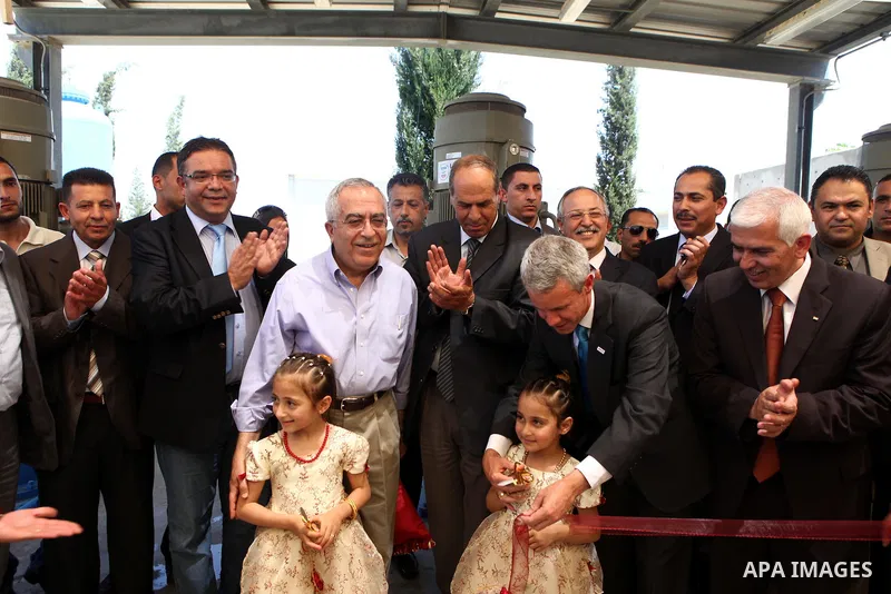 Palestinian prime minister Salam Fayyad attends the inauguration ceremony for well stations rehabilitation project in the southern West Bank village of Tuqu'a, which was financed by the US Agency for international Develo...