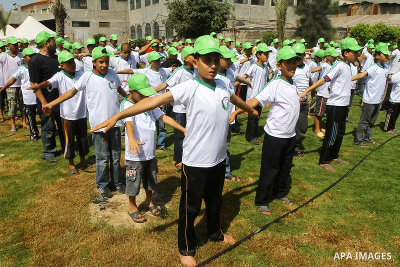 Palestinian boys attend a summer camp organised by the Islamist movement Hamas in Gaza City on June 23, 2011. Photo by Ashraf Amra