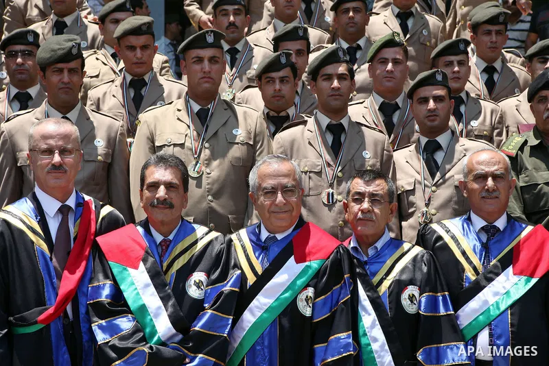 Palestinian Prime Minister, Salam Fayyad attends the graduation ceremony of the students of security, intelligence and the Hebrew language Diploma in the West Bank city of Ramallah on Jun 23,2011. Photo by Mustafa Abu Da...
