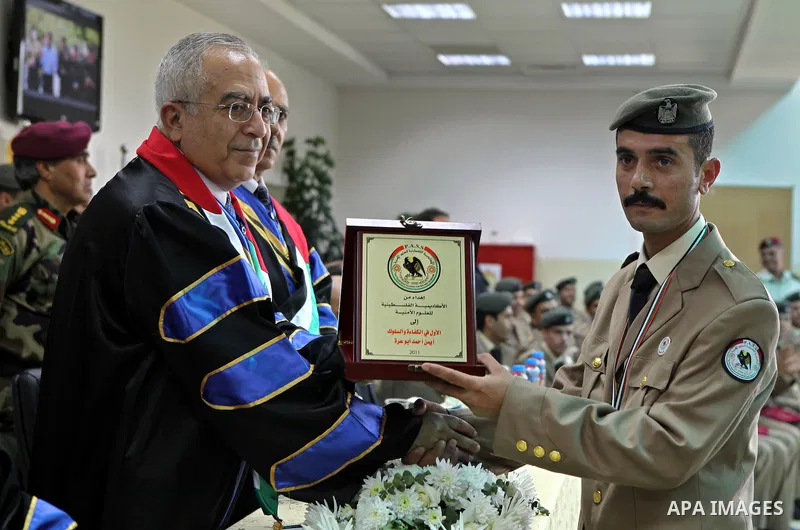 Palestinian Prime Minister, Salam Fayyad attends the graduation ceremony of the students of security, intelligence and the Hebrew language Diploma in the West Bank city of Ramallah on Jun 23,2011. Photo by Mustafa Abu Da...