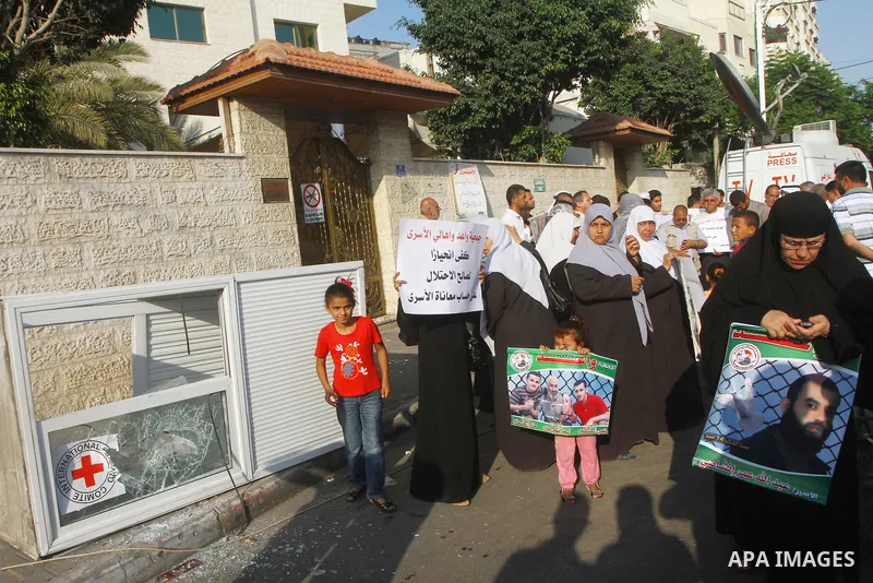 Palestinian prisoners relatives protest outside the International Committee of the Red Cross (ICRC) as dozens of angry protesters demonstrated outside the premises of the ICRC in Gaza City on June 23, 2011 against a call...