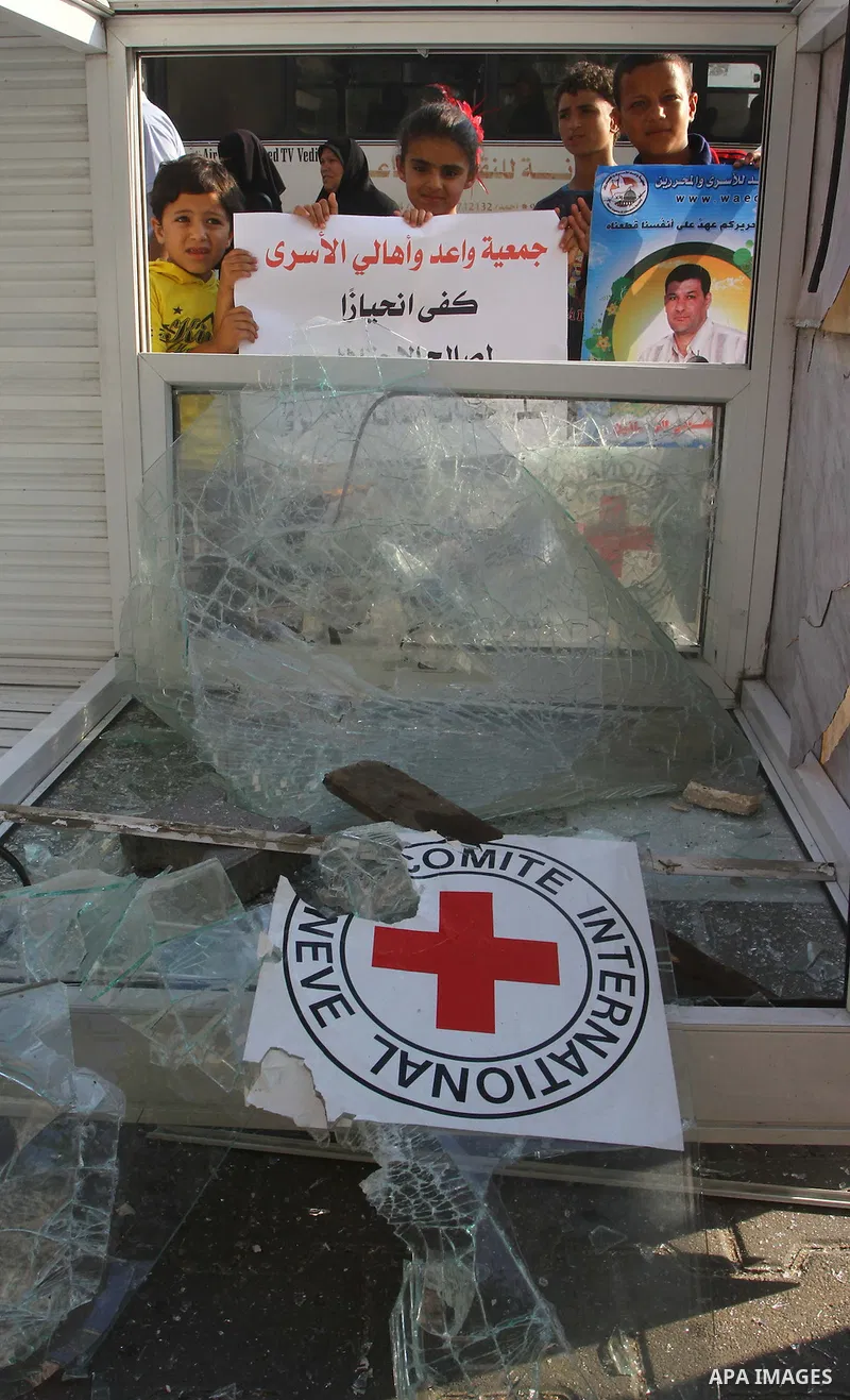 Palestinian prisoners relatives protest outside the International Committee of the Red Cross (ICRC) as dozens of angry protesters demonstrated outside the premises of the ICRC in Gaza City on June 23, 2011 against a call...