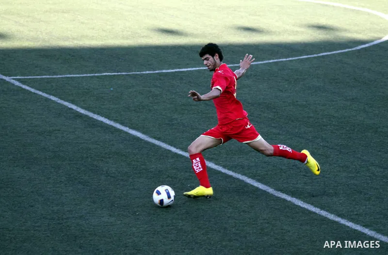 Bahrain's team player kicks the ball in the match between his national team and Palestinian team during their 2012 Olympic qualifying football match in the West Bank town of Al-Ram, near Ramallah, on June 23, 2011 . Phot...