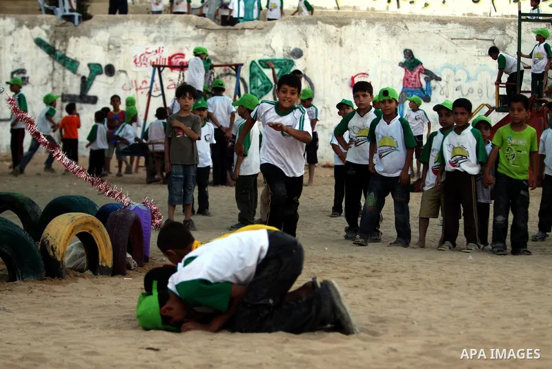 Palestinian boys play at a summer camp organised by the Islamist movement Hamas in Gaza City on June 23, 2011. Photo by Ali Jadallah