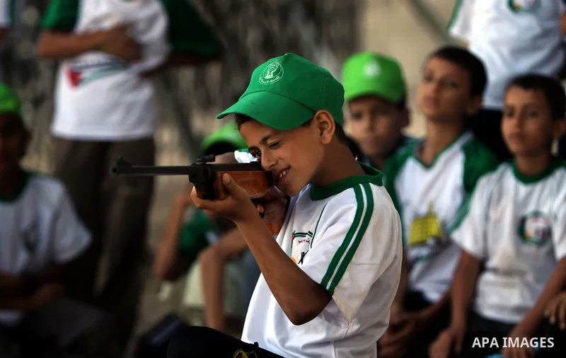 Palestinian boys play at a summer camp organised by the Islamist movement Hamas in Gaza City on June 23, 2011. Photo by Ali Jadallah