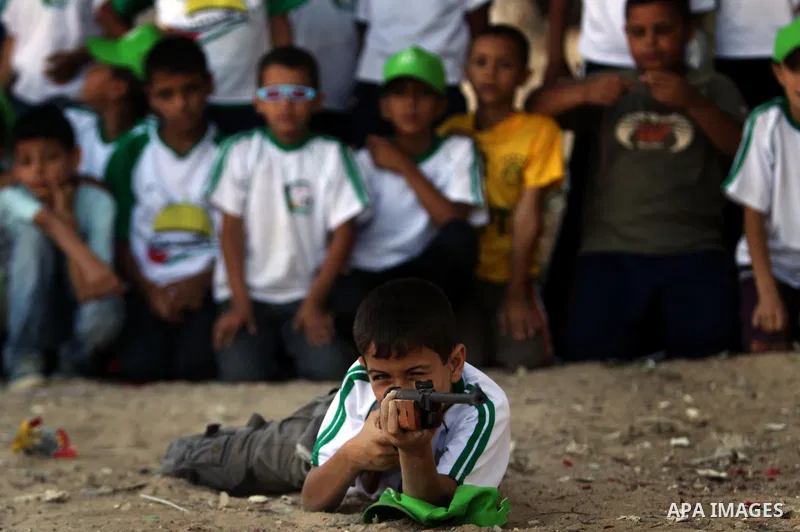 Palestinian boys play at a summer camp organised by the Islamist movement Hamas in Gaza City on June 23, 2011. Photo by Ali Jadallah