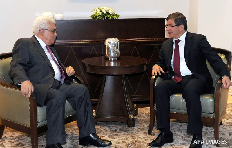 Palestinian President Mahmoud Abbas meets with Turkey's foreign minister, Ahmed Oglu in Ankara on Jun 23,2011. Photo by Thaer Ganaim