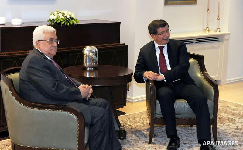Palestinian President Mahmoud Abbas meets with Turkey's foreign minister, Ahmed Oglu in Ankara on Jun 23,2011. Photo by Thaer Ganaim