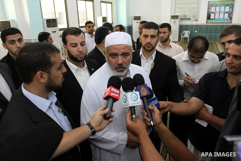 Palestinian prime minister in Gaza Strip, Ismail Haniya speaks to media after his meeting with members of ''Miles of Smiles 3'' aid convoy following Friday prayers at Al-Gharbi mosque in Gaza city on Jun 24,2011.. Photo...