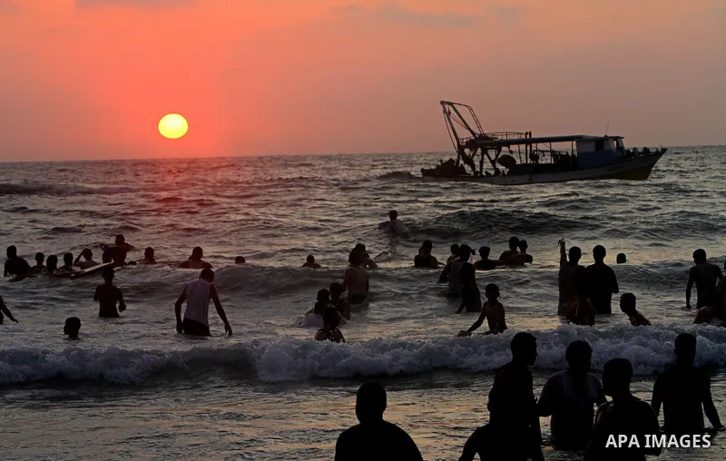 Palestinians enjoy a day at the beach in Gaza City on June 24, 2011. Photo by Ashraf Amra