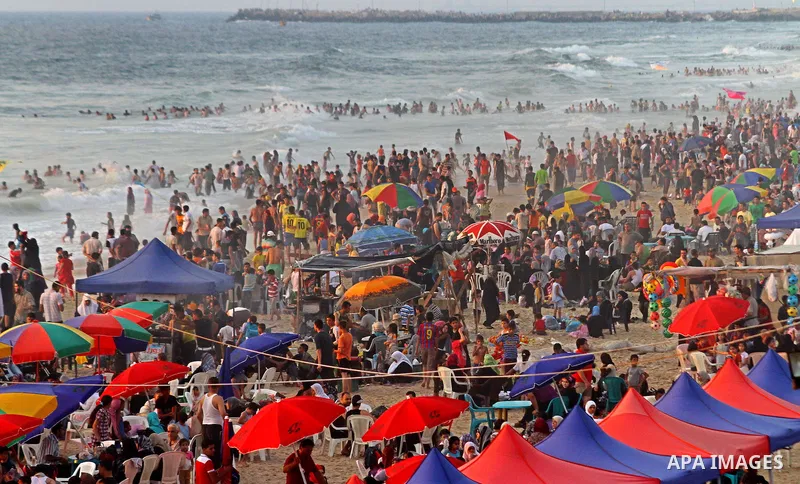 Palestinians enjoy a day at the beach in Gaza City on June 24, 2011. Photo by Ashraf Amra