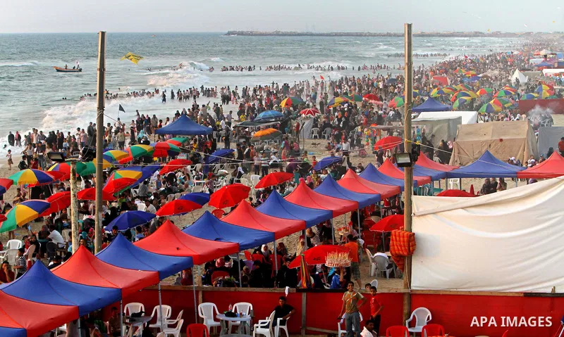 Palestinians enjoy a day at the beach in Gaza City on June 24, 2011. Photo by Ashraf Amra