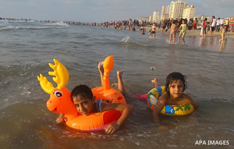 Palestinians enjoy a day at the beach in Gaza City on June 24, 2011. Photo by Ashraf Amra