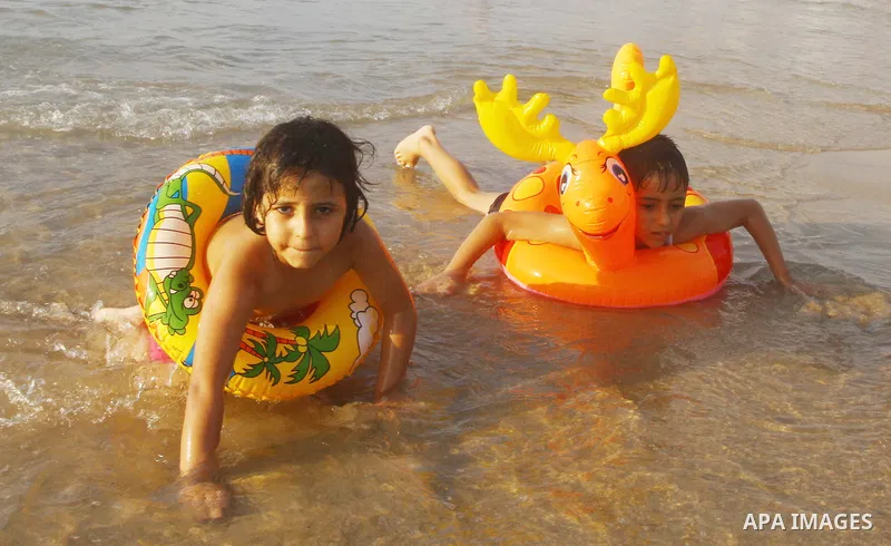 Palestinians enjoy a day at the beach in Gaza City on June 24, 2011. Photo by Ashraf Amra