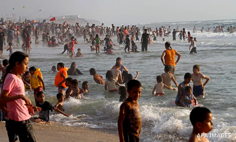 Palestinians enjoy a day at the beach in Gaza City on June 24, 2011. Photo by Ashraf Amra