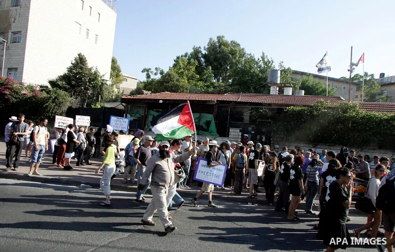 Israeli, Palestinian and foreign activists take part in a weekly demonstration against Israel's occupation of Palestinian land on Jun 24, 2011 in the mostly Arab Jerusalem neighborhood of Sheikh Jarrah. Photo by Mahfouz...