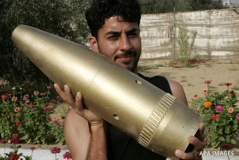 A Palestinian man retains the missiles did not explode in his house as a form of art in the east of Khan Younis in the southern Gaza Strip on June 25, 2011. The Red Cross called on Hamas on 23 June 2011 to provide proof...