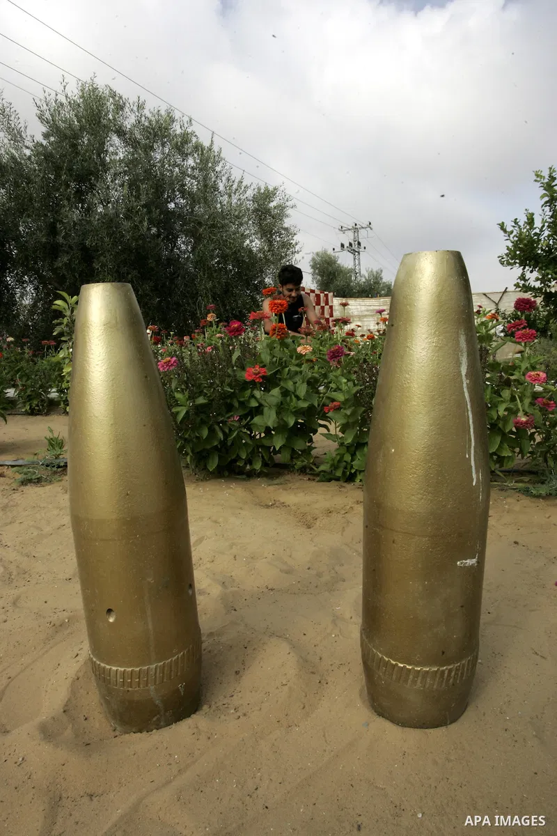 A Palestinian man retains the missiles did not explode in his house as a form of art in the east of Khan Younis in the southern Gaza Strip on June 25, 2011. The Red Cross called on Hamas on 23 June 2011 to provide proof...