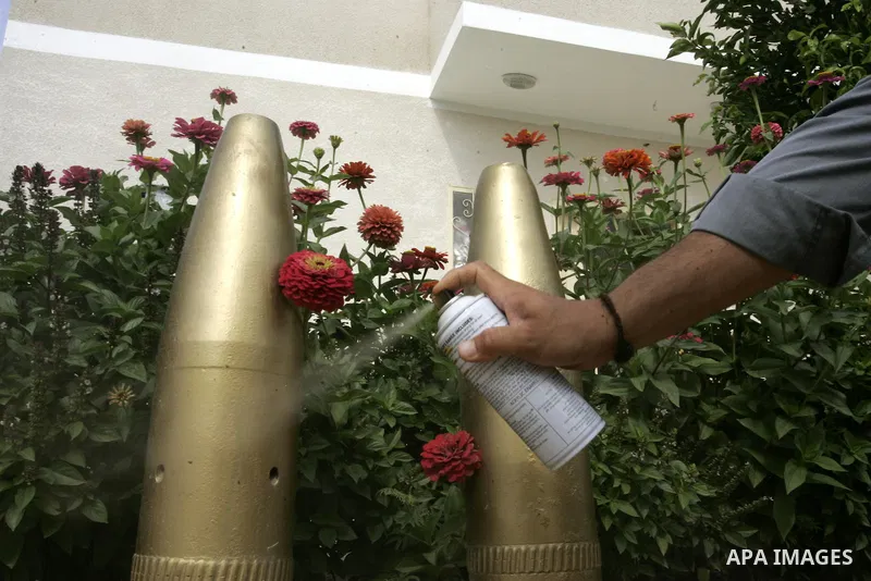 A Palestinian man retains the missiles did not explode in his house as a form of art in the east of Khan Younis in the southern Gaza Strip on June 25, 2011. The Red Cross called on Hamas on 23 June 2011 to provide proof...