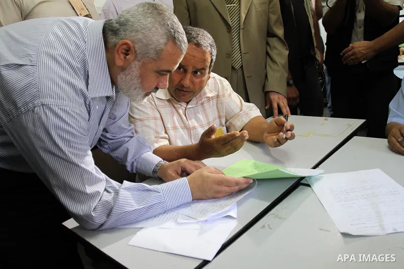 Palestinian Prime Minister in Gaza Strip, Ismail Haniya inspects teachers during correcting the papers of the high school exams known as "Tawjihi" , in Gaza City on June 25, 2011. Photo by Mohammed Asad