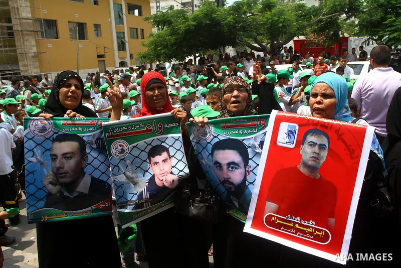 Palestinians shout slogans during a protest in Gaza City calling for the release of Palestinian prisoners held in Israeli jails, on June 27, 2011. Photo by Ashraf Amra