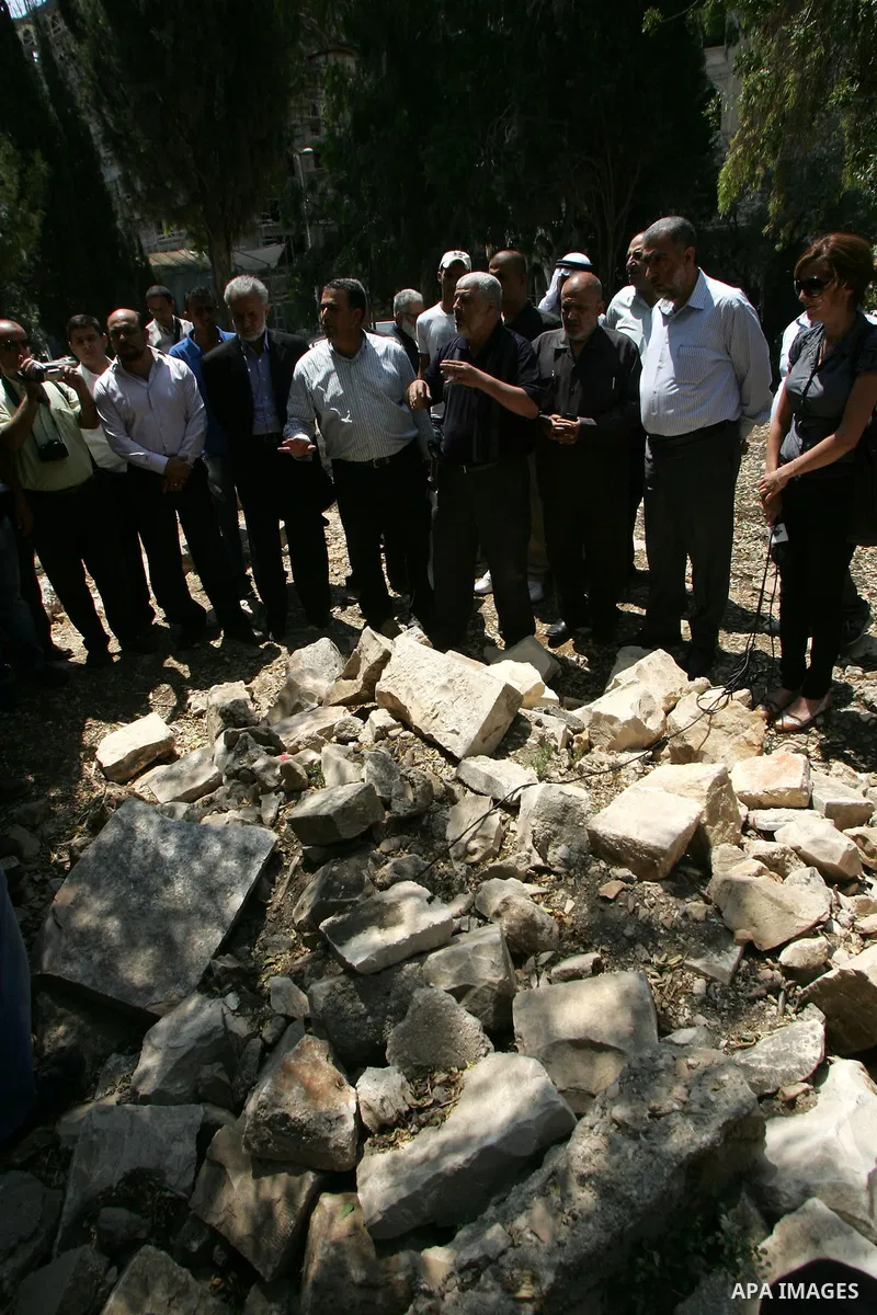 Palestinians and Israeli Arab kenaset members take a part in a protest to the Israeli violations of the Islamic sanctities in Jerusalem on June 27, 2011. where washed away and destroyed yesterday about 100 grave in "Maam...